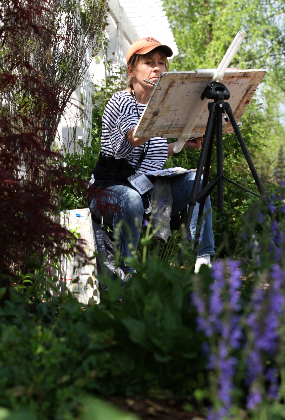 Alicia Farris paints among flowers